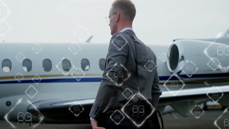 Businessman-walking-towards-private-jet-with-6G-network-animation-overlaid