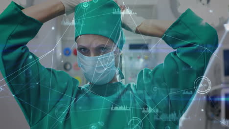 Surgeon-preparing-for-operation-with-medical-data-network-animation-over-scene