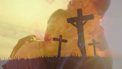 Embracing-couple-with-crosses-and-sunset-animation-in-background