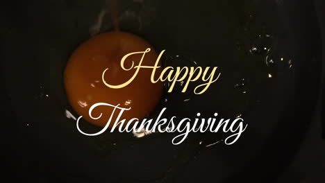 Happy-Thanksgiving-text-animation-over-close-up-of-egg-yolk-in-frying-pan