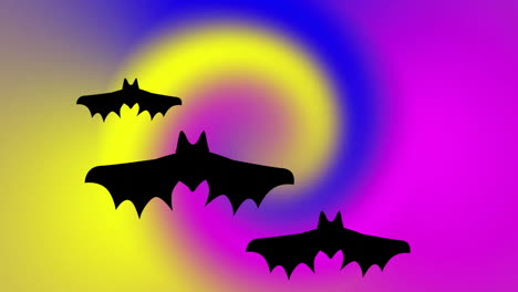 Flying-bats-silhouettes-over-colorful-swirling-background-in-animation