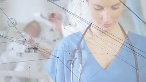 Data-processing-and-network-connections-animation-over-healthcare-professional-in-hospital