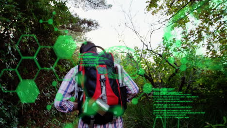 Walking-on-trail,-hiker-with-backpack,-green-scientific-data-animation-overlay