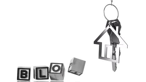 Keychain-with-house-shaped-pendant-over-animation-of-blocks-spelling-BLOG