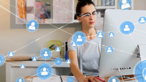 Working-at-desk,-woman-surrounded-by-social-network-connections-animation