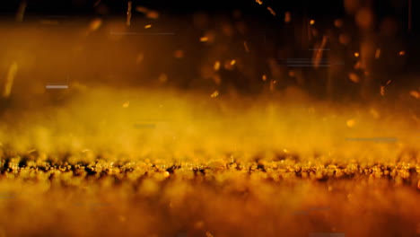 Golden-particles-floating-over-ground,-data-processing-animation-in-background