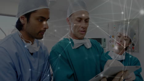 Reviewing-tablet-data,-medical-professionals-with-network-connections-animation-over-them