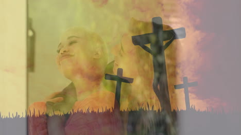 Crosses-and-crucifixion-animation-over-smiling-people-in-warm-light