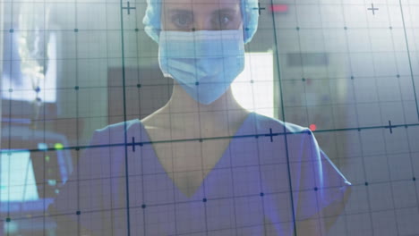 Wearing-mask-and-cap,-medical-professional-with-data-grid-animation-in-hospital-background