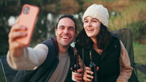 Selfie,-camping-and-couple-with-beer-by-a-river