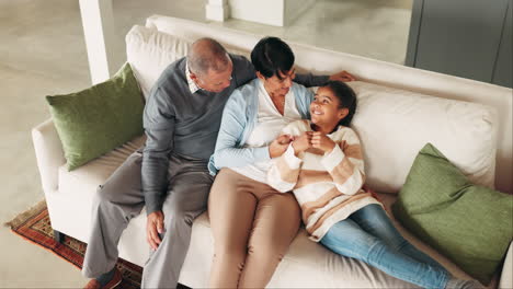 Girl,-relax-and-grandparents-talking-on-the-sofa