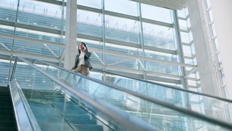 Escalator,-phone-call-and-business-woman-in-office