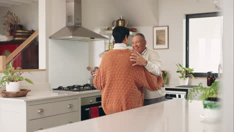 Mature-couple,-dancing-and-kitchen-with-love