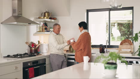 Old-couple-in-kitchen,-talking-and-coffee