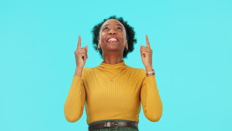 Face,-happy-black-woman-and-pointing-up-in-studio