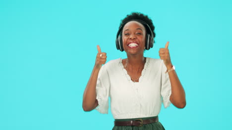 Pointing,-headphones-and-black-woman-with-thumbs