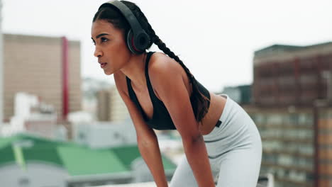 Woman,-headphones-and-fitness-on-rooftop-for-break