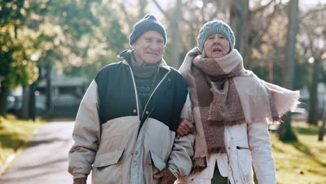 Old-couple,-walking-in-park-and-winter-with-love