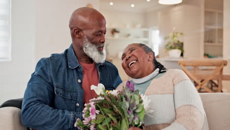 Sofa,-flowers-and-love-with-a-senior-black-couple