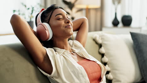 Woman,-home-with-headphones-and-music