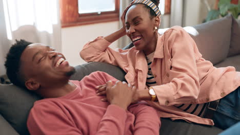 Funny,-home-and-black-couple-on-a-couch