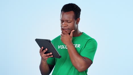 Thinking,-volunteer-and-black-man-with-a-tablet