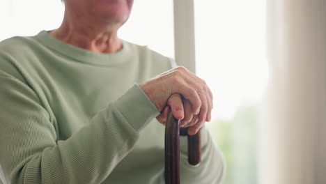 Closeup,-hands-and-elderly-man-with-a-cane