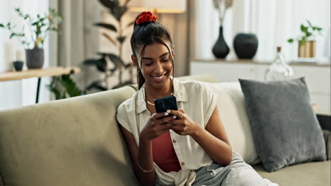 Woman,-phone-and-communication-with-smile-on-sofa