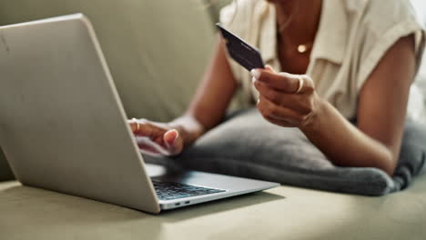 Credit-card,-hands-or-woman-in-home-with-laptop