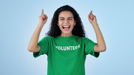 Volunteer,-pointing-up-and-face-of-woman-on-blue