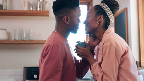 Kiss,-kitchen-and-happy-black-couple-with-coffee