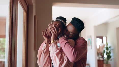 Black-couple,-cover-eyes-and-surprise-hug