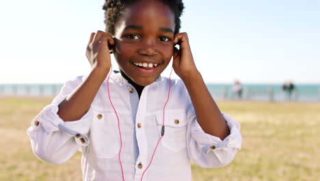 Kid-portrait,-headphones-and-music-of-a-child