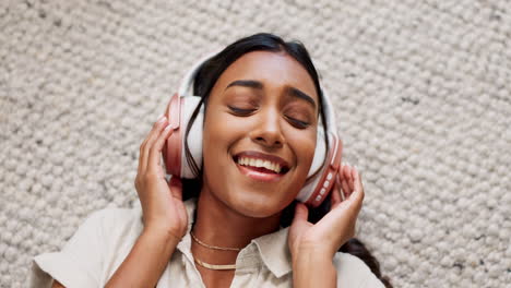 Woman,-headphones-and-relax-on-floor-listening-to
