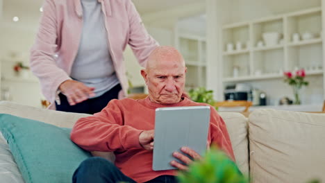 Old-couple,-hug-and-relax-with-tablet-on-sofa