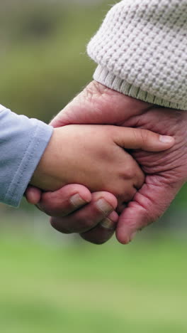 Holding-hands,-grandparent