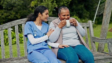 Happy-woman,-nurse-and-patient-with-coffee-on-park
