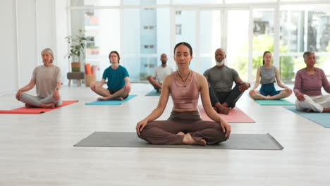 Yoga,-men-and-women-in-studio-with-meditation