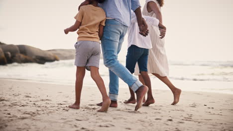 Walking,-legs-of-happy-family-on-beach-together
