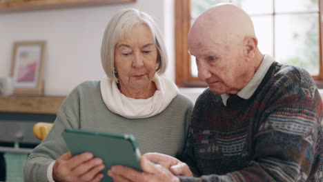 Senior-couple,-tablet-and-showing-in-living-room