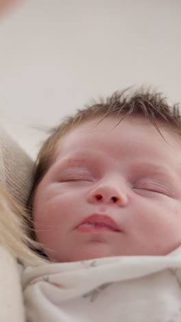 Peaceful,-sleeping-and-newborn-baby-on-a-bed