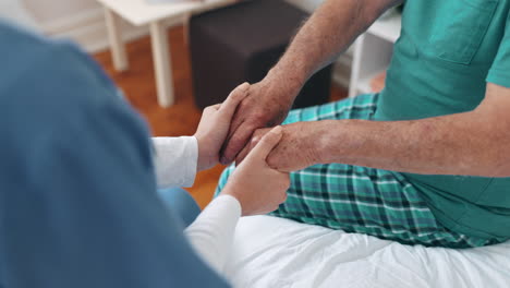 Nurse,-holding-hands-and-support-patient-on-bed
