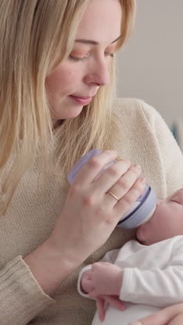 Milk,-bottle-and-a-woman-feeding-her-baby