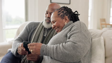 Phone,-smile-and-senior-black-couple-on-sofa