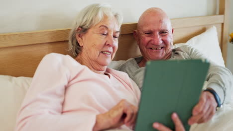 Senior,-couple-and-tablet-in-bedroom-happy
