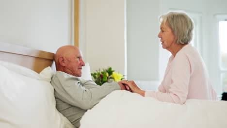 Senior,-couple-and-holding-hands-in-bed