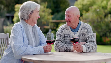 Senior-couple,-wine-and-looking-in-garden