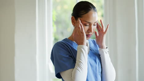 Window,-headache-and-nurse-with-burnout
