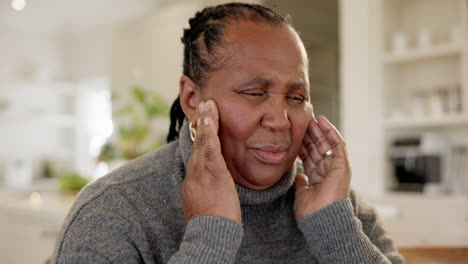 Elderly-black-woman,-hands-on-temple-and-headache