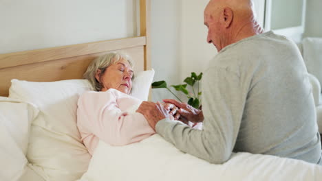 Senior,-couple-and-holding-hands-in-bed